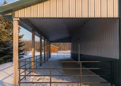 Covered run-in shelter horse barn in snowy Ontario landscape