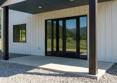 Insulated metal pole barn workshop with a man door entrance