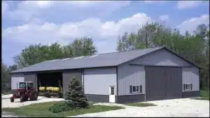 Side profile of a 105x54 steel storage facility in Sudbury, Ontario with a tractor outside.