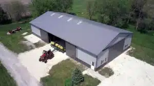 Aerial view of a 105x54 steel storage building in Sudbury, Ontario with a red tractor.