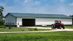 Exterior of a 120x60 steel barn with tractor in Thunder Bay, Ontario.