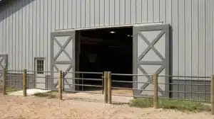 Steel equestrian building with sliding barn doors in Milton, Ontario.
