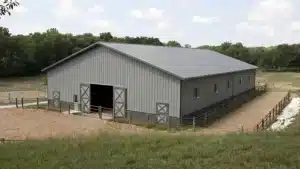 120x68 steel equestrian arena kit in Milton, Ontario, with metal barn exterior.