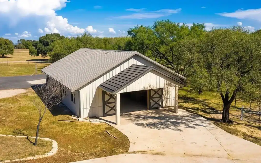 60x40 steel equestrian building in Ontario surrounded by trees.