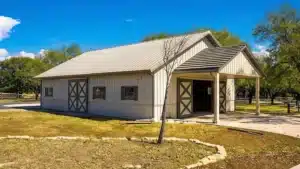 60x40 steel barn with metal siding in a rural setting