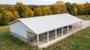 60x42 custom metal barn in Kingston, Ontario with a view of autumn trees