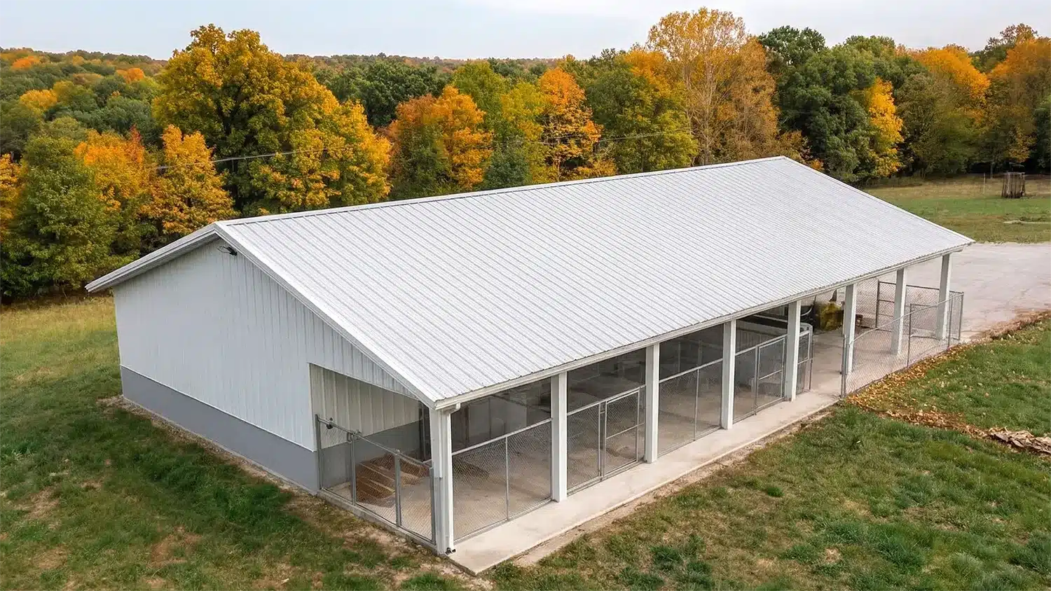 60x42 custom metal barn in Kingston, Ontario with a view of autumn trees