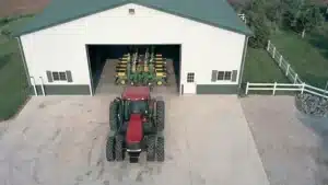 Aerial view of a 60x60 steel workshop with farm equipment in Kitchener, Ontario