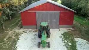 Overhead view of red steel barn with tractor in front in Hamilton, Ontario