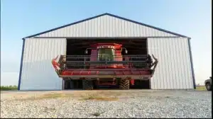 Steel barn with high clearance door and farm equipment in Windsor, Ontario.