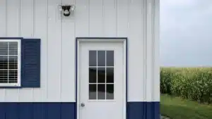 Steel barn entry door with blue trim in Brampton, Ontario.